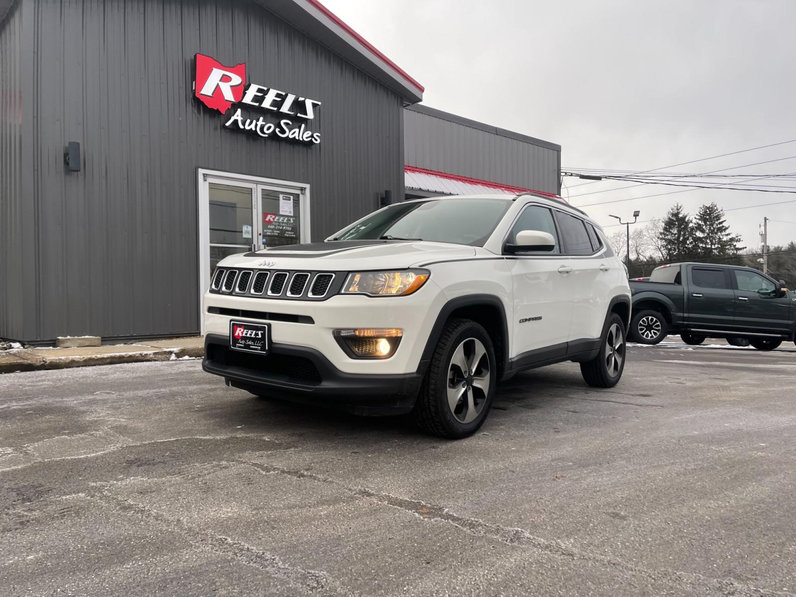 2018 White /White Jeep Compass Latitude 4WD (3C4NJDBB3JT) with an 2.4L I4 DOHC 16V engine, 9 Speed Automatic transmission, located at 11115 Chardon Rd. , Chardon, OH, 44024, (440) 214-9705, 41.580246, -81.241943 - This 2018 Jeep Compass Latitude 4WD with a 2.4-liter engine and 9-speed automatic transmission offers a blend of utility and comfort with its heated leather seats and dual-zone automatic climate control. The 8.4-inch touchscreen provides user-friendly access to navigation, Apple CarPlay, and Android - Photo #0